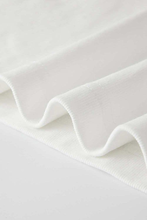 Fitted High-Neck Ribbed Cropped Tank Top in White - hem detail