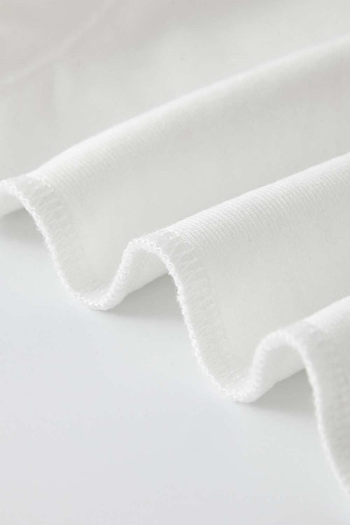 Fitted High-Neck Ribbed Cropped Tank Top in White - fabric texture close-up