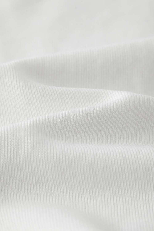 Fitted High-Neck Ribbed Cropped Tank Top in White - fabric texture close-up