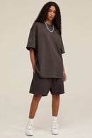 Heavyweight Cotton-Blend Relaxed Sweat Shorts in Charcoal - three-quarter front modeled view