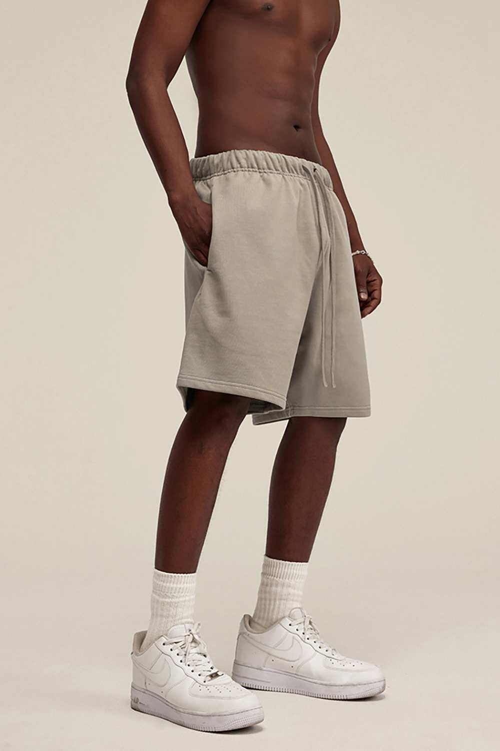 Heavyweight Cotton-Blend Relaxed Sweat Shorts in Gray Apricot - three-quarter front modeled view