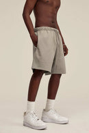 Heavyweight Cotton-Blend Relaxed Sweat Shorts in Gray Apricot - three-quarter front modeled view