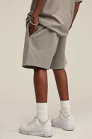 Heavyweight Cotton-Blend Relaxed Sweat Shorts in Gray Apricot - product detail close-up