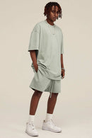 Heavyweight Cotton-Blend Relaxed Sweat Shorts in Halo Green - three-quarter front modeled view