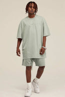 Heavyweight Cotton-Blend Relaxed Sweat Shorts in Halo Green - full-length front modeled view