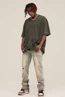 Washed Distressed-Fade Relaxed Cotton T-Shirt in Grayish Green - full-length front modeled view