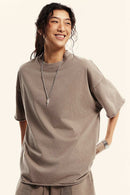Heavyweight Washed Raw-Edge Cotton T-Shirt in Mud - front modeled view