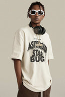 Washed Layered-Letter Graphic Relaxed Cotton T-Shirt in Gray Apricot - three-quarter front modeled view
