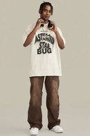 Washed Layered-Letter Graphic Relaxed Cotton T-Shirt in Gray Apricot - full-length front modeled view