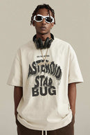 Washed Layered-Letter Graphic Relaxed Cotton T-Shirt in Gray Apricot - front modeled close-up