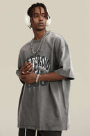 Washed Layered-Letter Graphic Relaxed Cotton T-Shirt in Medium Gray - three-quarter front modeled view