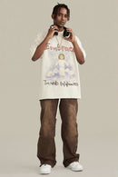 Washed Angel-Graphic Relaxed Cotton T-Shirt in Gray Apricot - full-length front modeled view