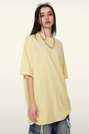 Heavyweight Cotton Relaxed Drop-Shoulder T-Shirt in Cream Apricot - front modeled view