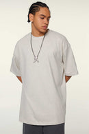 Heavyweight Cotton Relaxed Drop-Shoulder T-Shirt in Oat Gray - front modeled view
