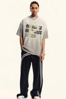 Washed Distressed-Lettering Boxy Graphic T-Shirt in Light Gray - full-length front modeled view