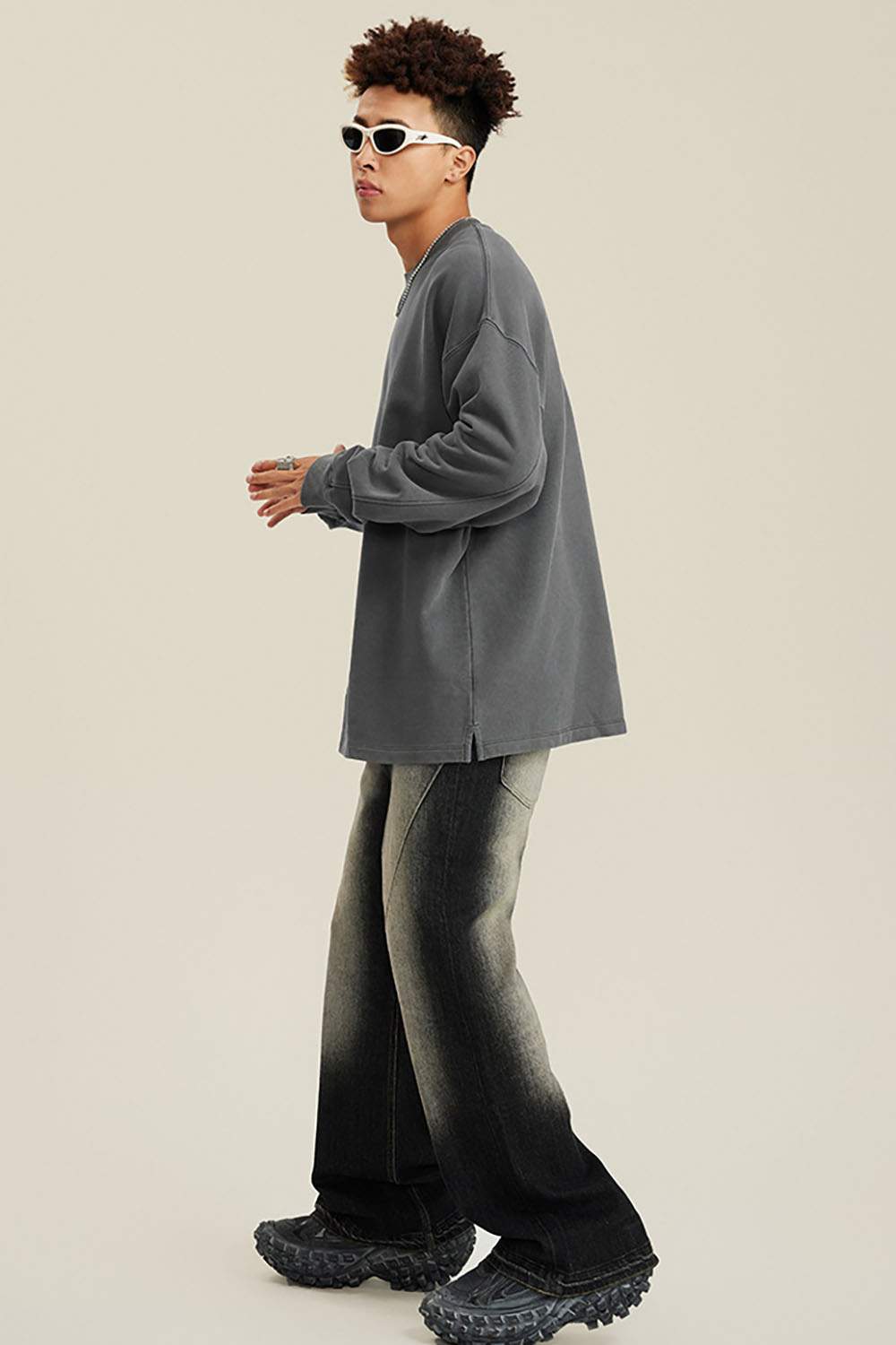 Washed Distressed Panel-Seam Flare Jeans in Black - full-length side modeled view