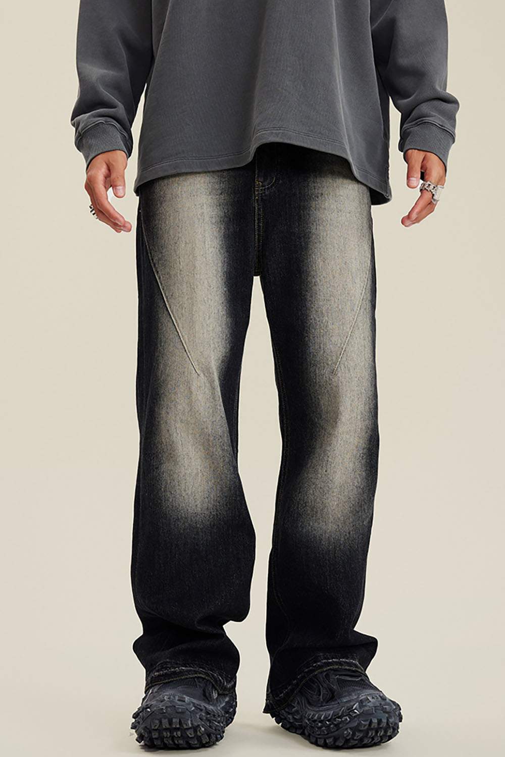 Washed Distressed Panel-Seam Flare Jeans in Black - front modeled view