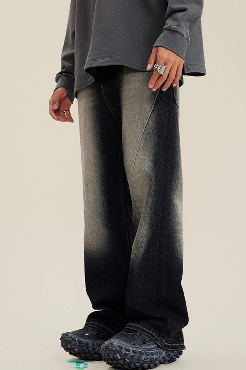 Washed Distressed Panel-Seam Flare Jeans in Black - three-quarter front modeled view