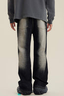 Washed Distressed Panel-Seam Flare Jeans in Black - back modeled view