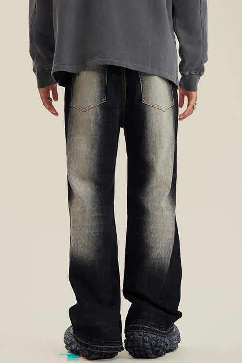 Washed Distressed Panel-Seam Flare Jeans in Black - back modeled view