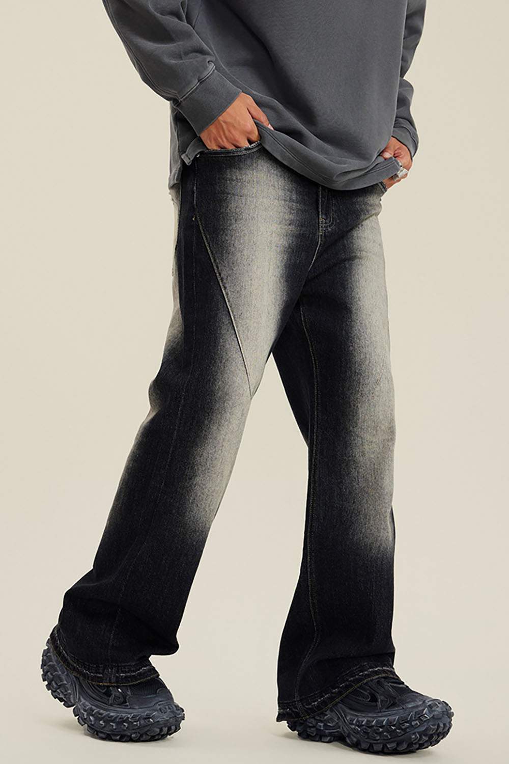 Washed Distressed Panel-Seam Flare Jeans in Black - front modeled view