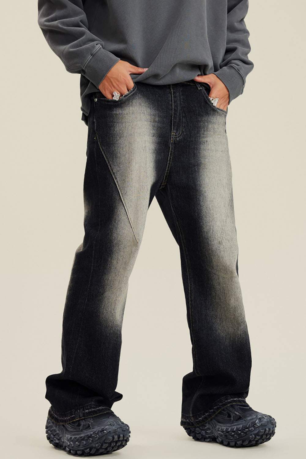 Washed Distressed Panel-Seam Flare Jeans in Black - front modeled view