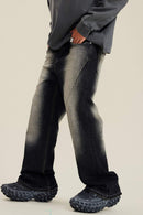 Washed Distressed Panel-Seam Flare Jeans in Black - three-quarter front modeled view