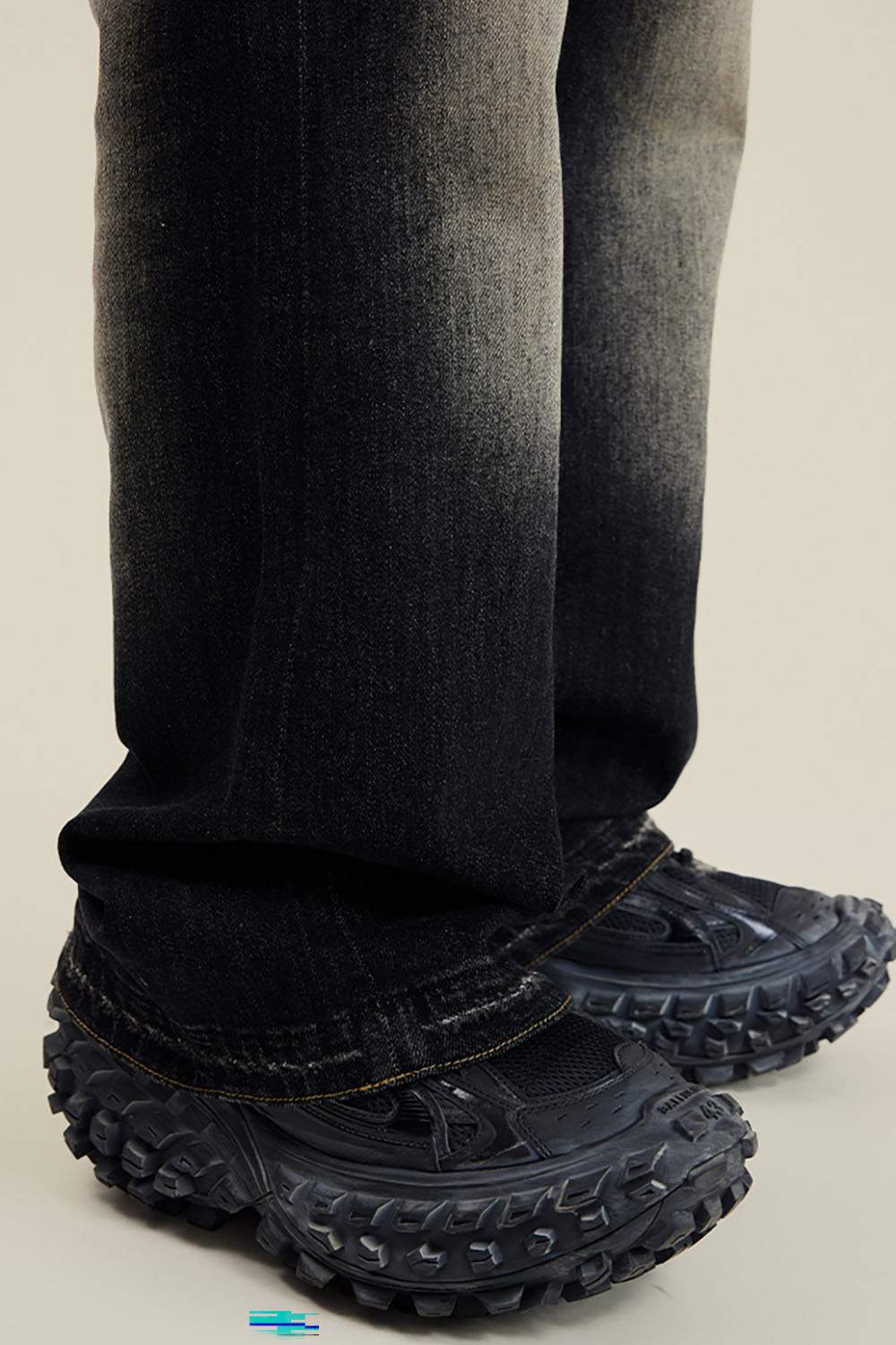 Washed Distressed Panel-Seam Flare Jeans in Black - leg opening detail