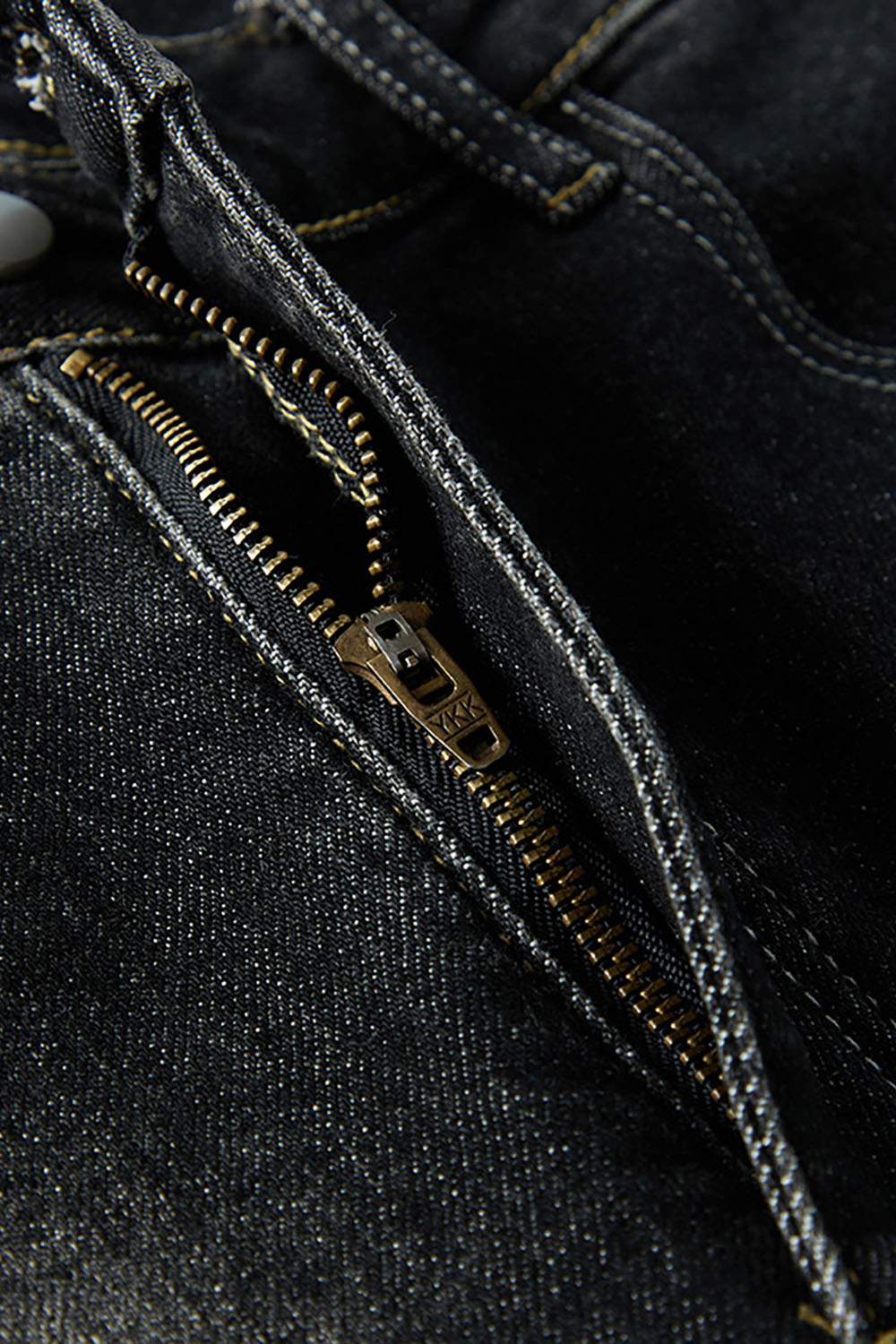 Washed Distressed Panel-Seam Flare Jeans in Black - zipper detail