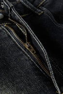 Washed Distressed Panel-Seam Flare Jeans in Black - zipper detail