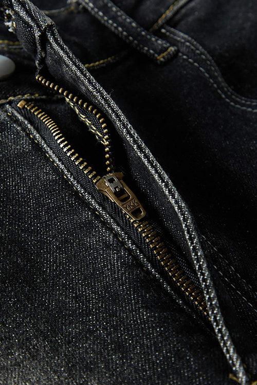Washed Distressed Panel-Seam Flare Jeans in Black - zipper detail