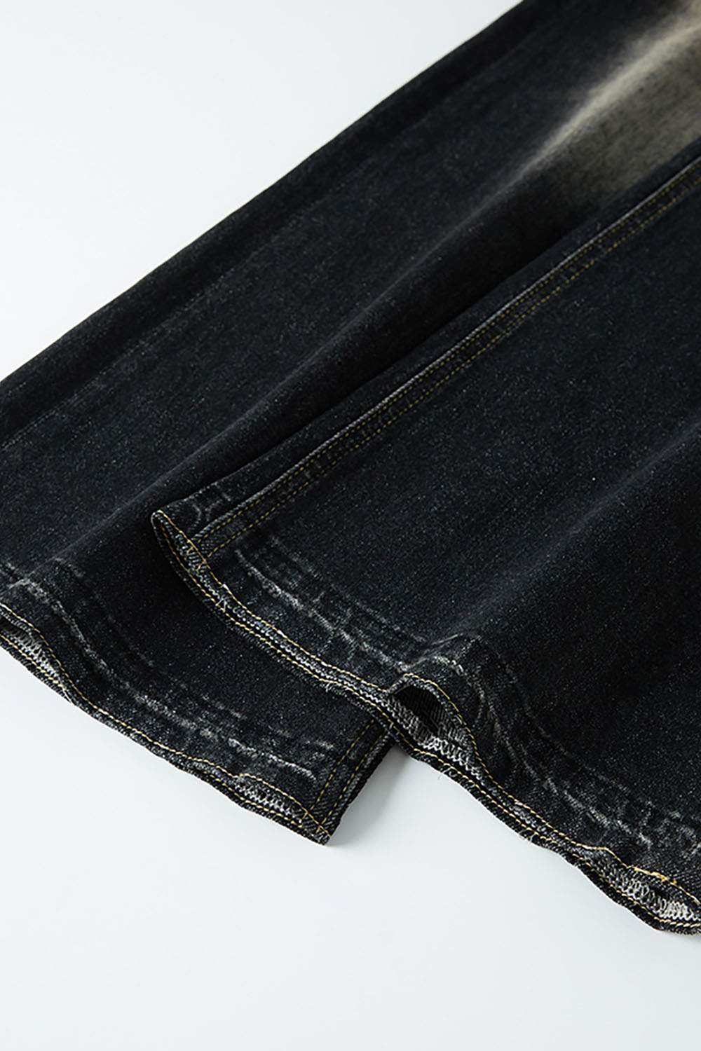 Washed Distressed Panel-Seam Flare Jeans in Black - back pocket detail