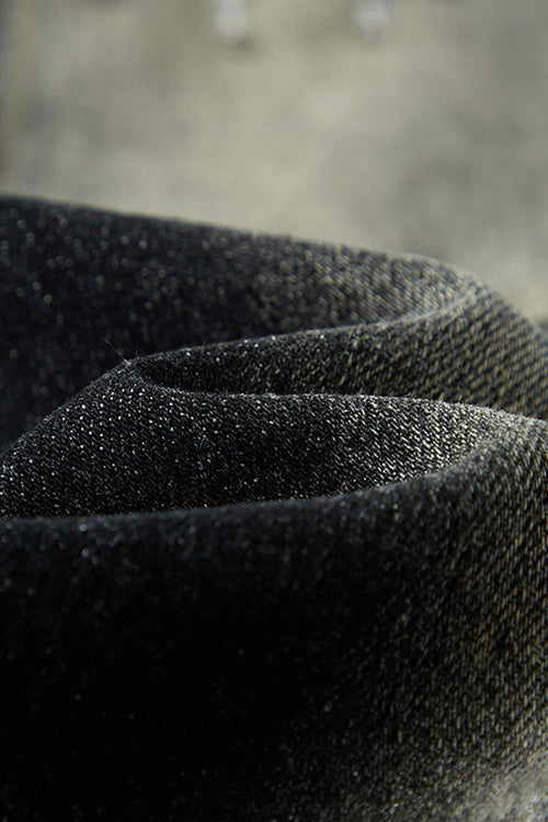 Washed Distressed Panel-Seam Flare Jeans in Black - leg opening detail