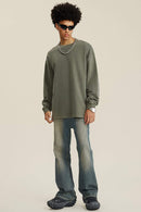 Washed Distressed Panel-Seam Flare Jeans in Denim Blue - full-length front modeled view