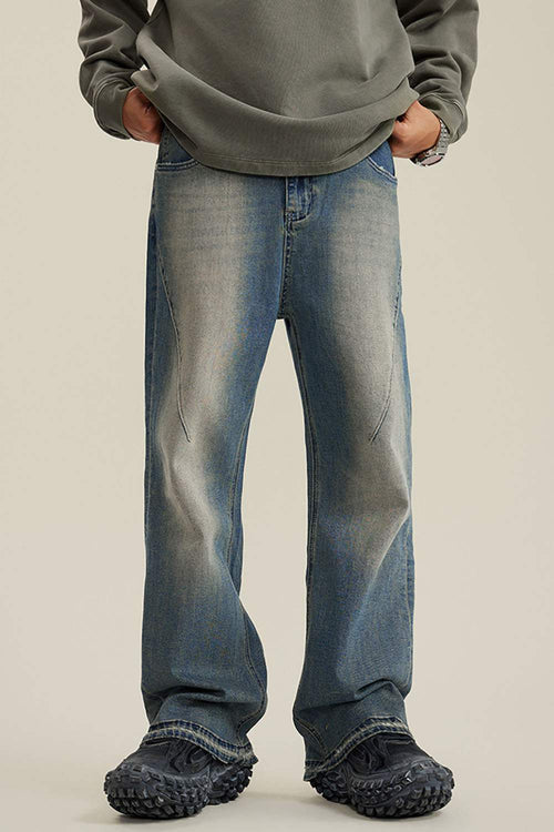 Washed Distressed Panel-Seam Flare Jeans in Denim Blue - front modeled view
