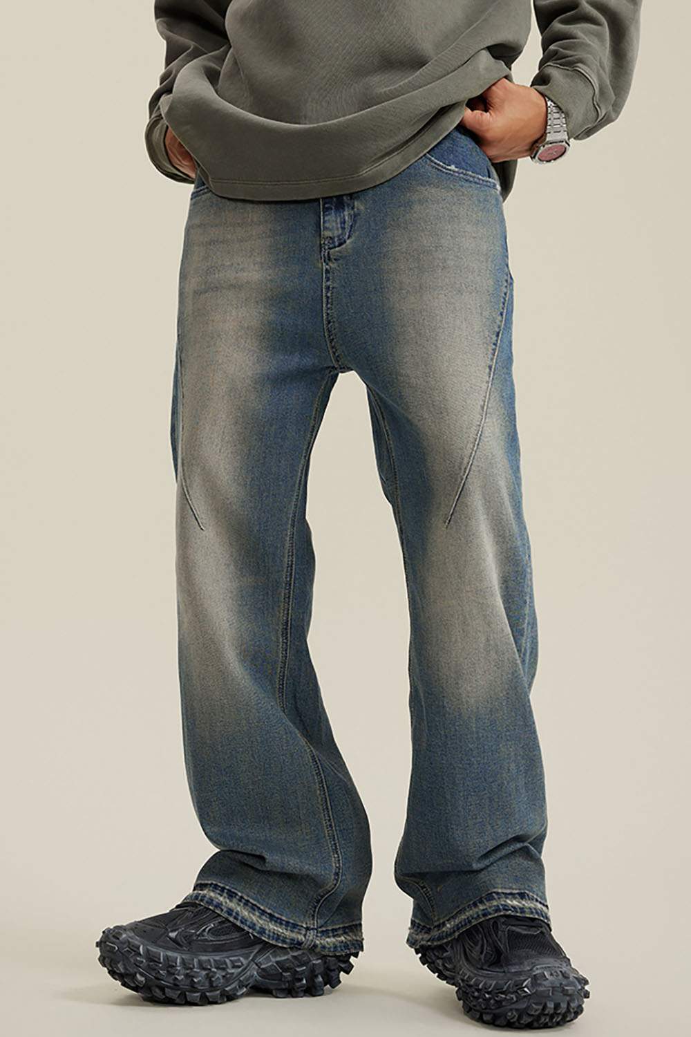 Washed Distressed Panel-Seam Flare Jeans in Denim Blue - front modeled view