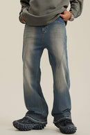 Washed Distressed Panel-Seam Flare Jeans in Denim Blue - front modeled view