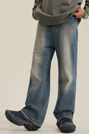 Washed Distressed Panel-Seam Flare Jeans in Denim Blue - front modeled view