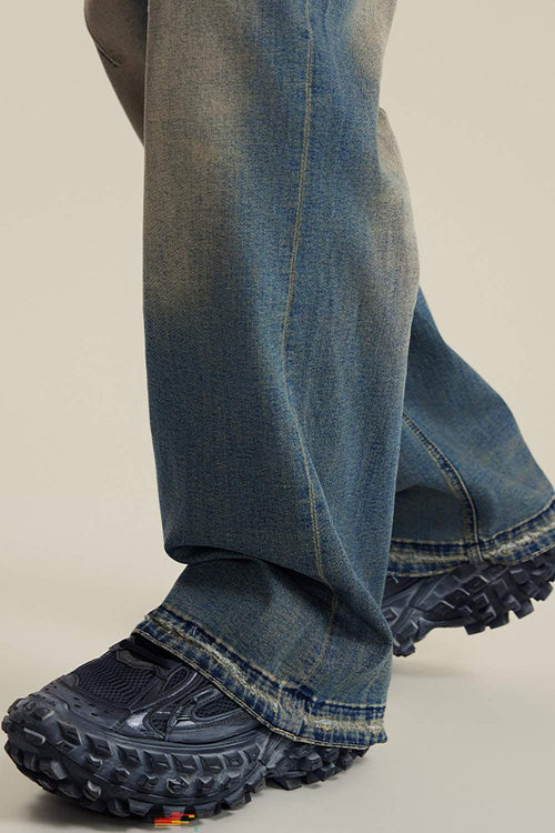 Washed Distressed Panel-Seam Flare Jeans in Denim Blue - leg opening detail