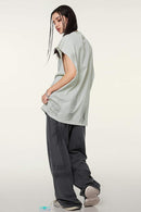 Distressed Brush-Mark Graphic Longline Cotton Tank in Light Gray - full-length back modeled view