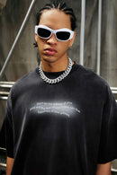 Washed Distressed-Neck Graphic Cotton T-Shirt in Black - product detail close-up