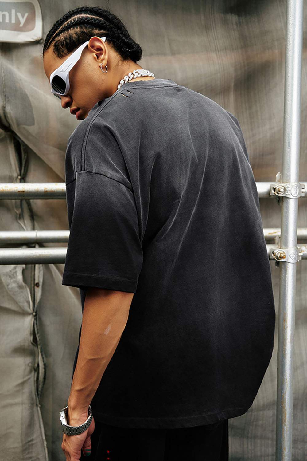 Washed Distressed-Neck Graphic Cotton T-Shirt in Black - rear three-quarter modeled view