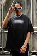 Washed Distressed-Neck Graphic Cotton T-Shirt in Black - front modeled close-up