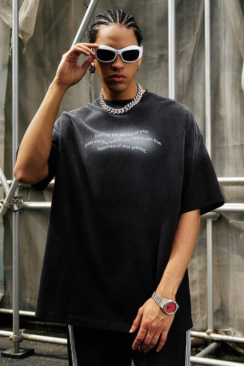 Washed Distressed-Neck Graphic Cotton T-Shirt in Black - front modeled close-up
