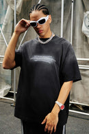 Washed Distressed-Neck Graphic Cotton T-Shirt in Black - three-quarter front modeled view