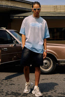 Washed Distressed-Neck Graphic Cotton T-Shirt in Blue - full-length front modeled view