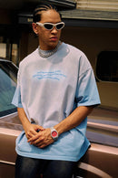 Washed Distressed-Neck Graphic Cotton T-Shirt in Blue - front modeled view