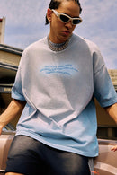 Washed Distressed-Neck Graphic Cotton T-Shirt in Blue - product detail close-up