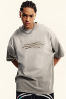 Washed Distressed-Neck Graphic Cotton T-Shirt in Light Gray - front modeled view