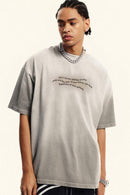 Washed Distressed-Neck Graphic Cotton T-Shirt in Light Gray - front modeled view